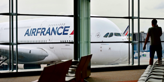 air France A380 at gate with guy waiting