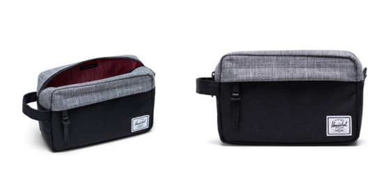 grey and black herschel toiletry bag, open with red inside