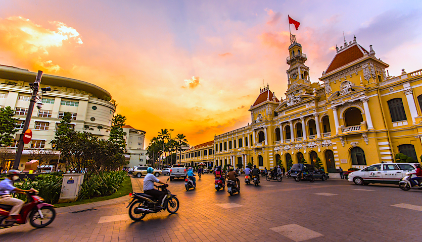 Ho Chi Minh City Town Hall in Vietnam with traffic