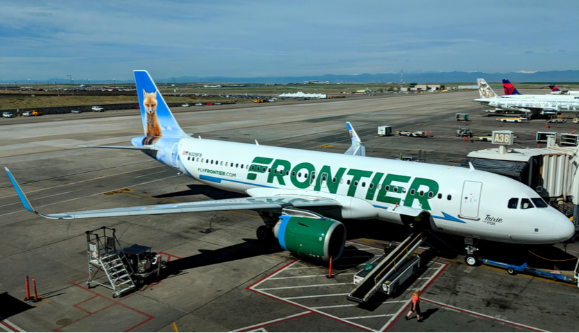 frontier airlines airplane at gate in denver