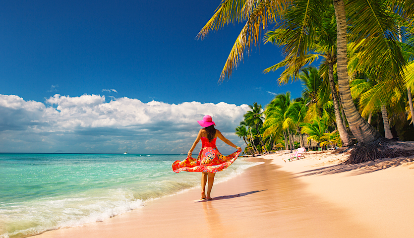 Woman walking on the beach in Punta Cana Dominican Republic