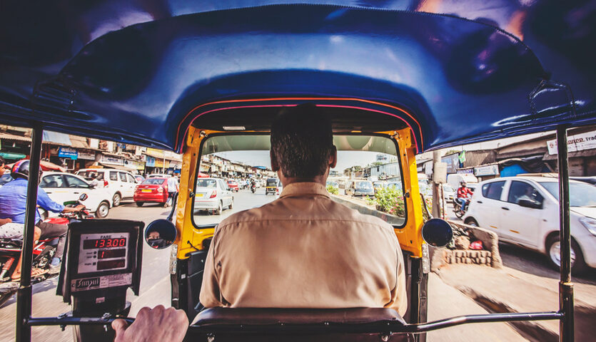 riding in a rickshaw car on the busy streets of Mumbai, India