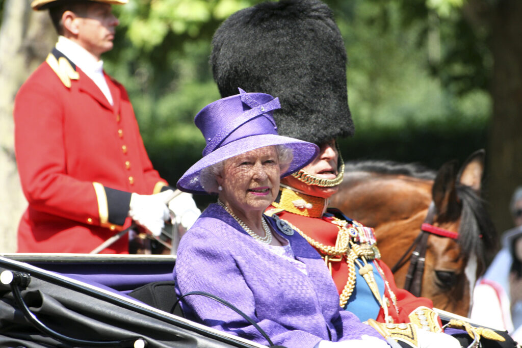 Queen-Elizabeth-Prince-Phillip-in-open-carriage-in-summer-procession